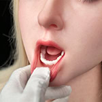 Realistic female doll with detailed facial features, open mouth, and expressive eyes for lifelike appearance.