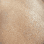 Detailed close-up of a realistic, smooth-skinned female doll's face with delicate features and natural complexion.