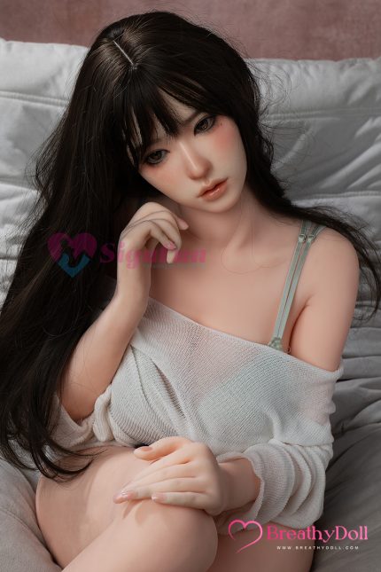 High-quality close-up of a realistic companion doll with long, dark hair, expressive eyes, and natural skin tone, dressed casually.