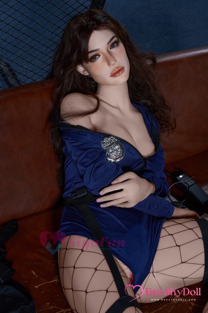 Highly detailed, lifelike female doll with long, wavy brown hair, expressive eyes, and full lips. Dressed in a navy blue outfit with a police badge, wearing fishnet stockings, perfect for collectors and companions.